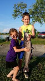 Kids holding a fish at Kopps Lake