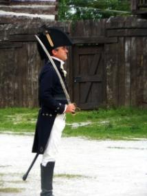 In pristine uniform, a costumed American office demonstrates proper form