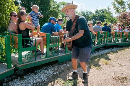 Woode Wood performs for families riding the Zilker Zephyr miniature train in Zilker Park