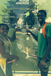 Nelda and Kyron from the IVB find their country, flag, and names on display at Hayward Field