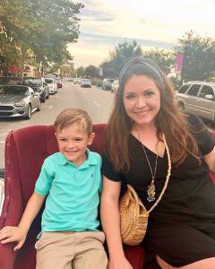 Mom and young son on carriage ride in The Market Common