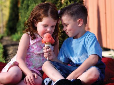Young boy & girl sharing Graeter's ice cream cone