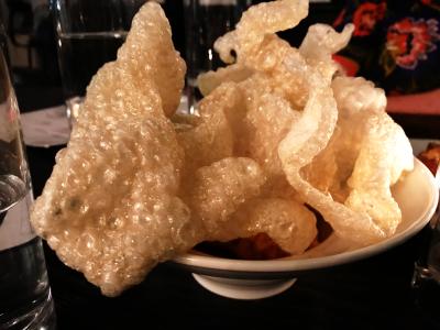 Service Bar's Cheese & Poof dish, an airy, crunchy food that resembles pork rinds