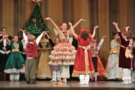 Wilmington Ballet Co. Nutcracker Performers with hands raised