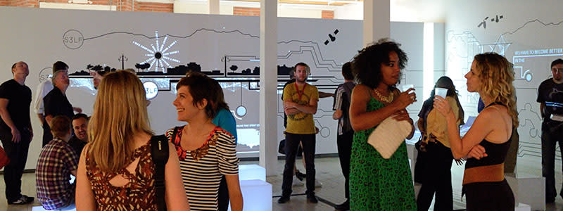 People socializing with drinks BMOCA