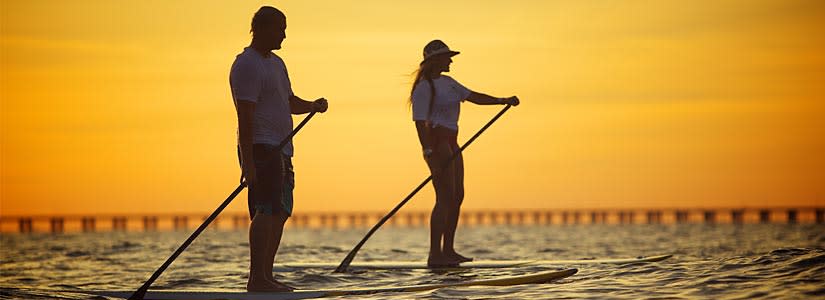 Couple Paddle Boarding in Virginia Beach