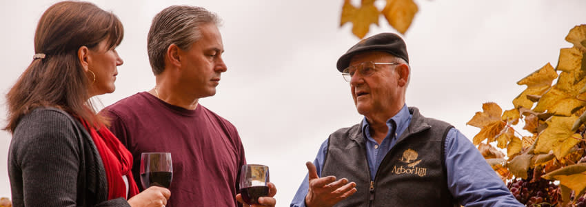 Couple Drinking Wine in vineyard at Arbor Hill in Naples