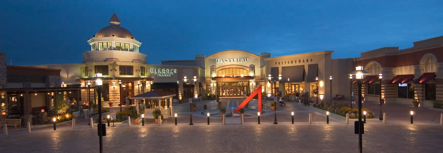 The front entrance of Eastview mall in Victor, NY lit up at night