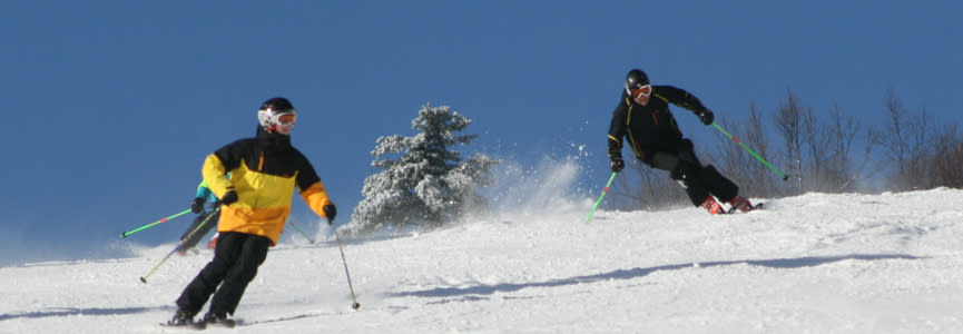 Downhill skiers on their way down Bristol Mountain in the Finger Lakes