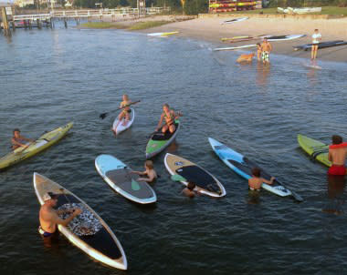 People on paddleboards and kayaks during Surf 2 Sound