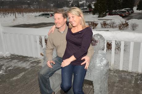 Couple sits on an ice bench at the NYS Ice Wine Festival