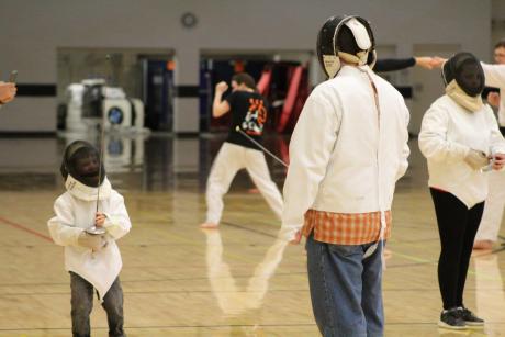 Little boy takes on father at fencing at Imagine RIT