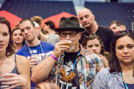 Man drinks beer at the Rochester Real Beer Expo