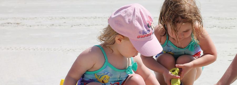 Toddlers enjoy making sand castles and shelling on Daytona Beach