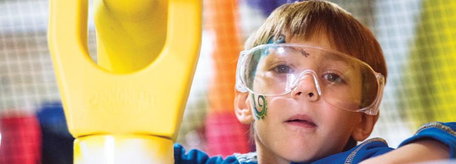 A young boy interacts with the exhibits at the Museum of Arts & Sciences Children's Museum