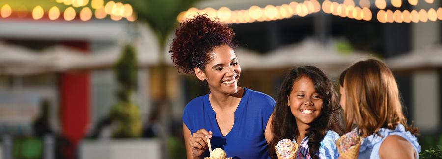 A mom treats her daughter and a friend to ice cream at ONE DAYTONA