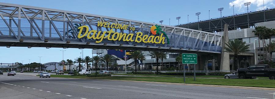 A pedestrian bridge across International Speedway Boulevard welcomes visitors