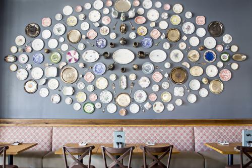 Tupelo Honey Button Wall Covered In Plates