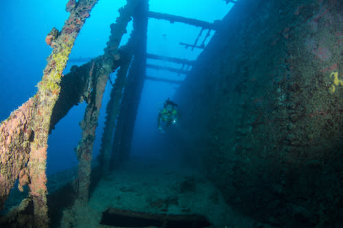 Diver swims down the starboard passageway