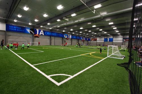 Youth soccer practicing indoors