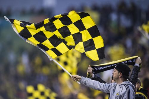 Crew SC fan waving a flag