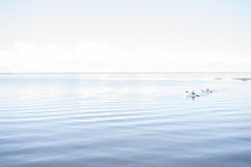 Visitors enjoy the calm waters as they kayak through the sound-side of the Outer Banks islands.