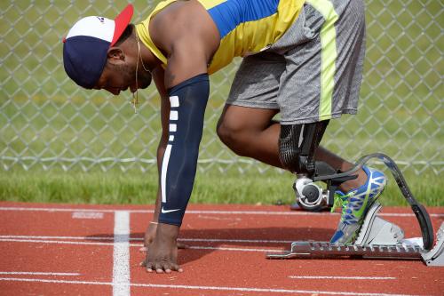 Adaptive Runner Prepares to Start Race Disabled Sports US