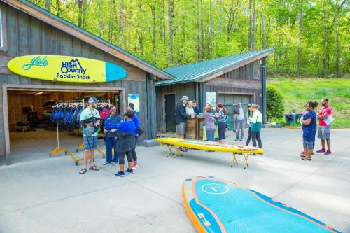 People renting paddle boards at High Country Outfitters Paddle Shack