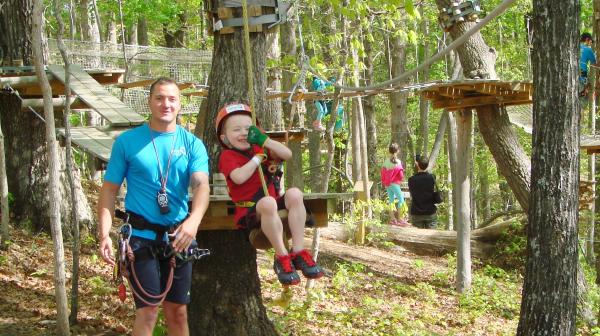 Little Boy Swinging at TreeTop Quest