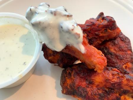 Chicken wings with homemade ranch dipping sauce at Magoo's