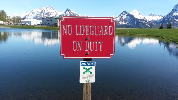 a sign for No Life Guard on Duty