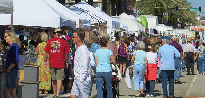 Halifax Art Festival goers stroll along the many tents on Beach Street.