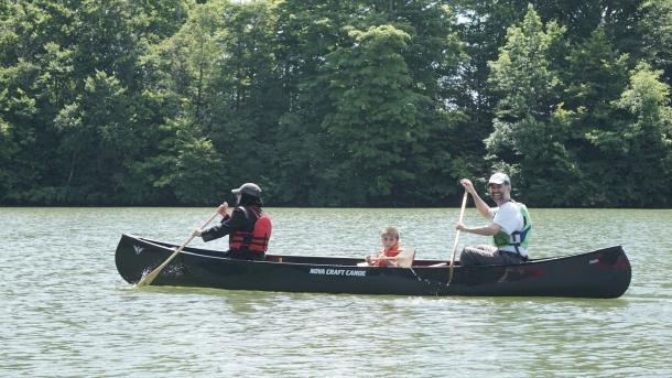 Family paddling at deer creek