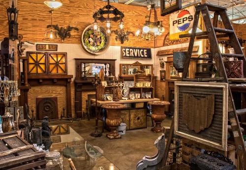 Various pieces of vintage furniture and decor inside the Columbus Architectural Salvage