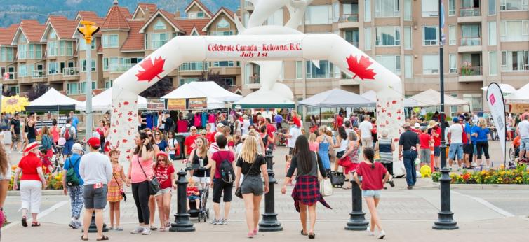 Crowds of people and decorations for Canada Day in Kelowna, BC