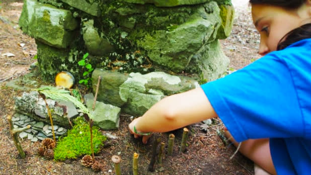Girl digging in ground at 61st Annual Allegany Nature Pilgrimage