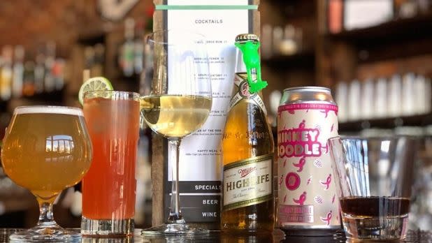A photo of cocktails on a bar counter at the Black Sheep Restaurant and Bar