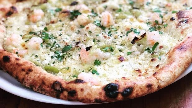 Closeup of pizza with shrimp topping at Apizza Regionale, Syracuse