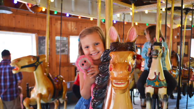 Child on Herschell Carrousel