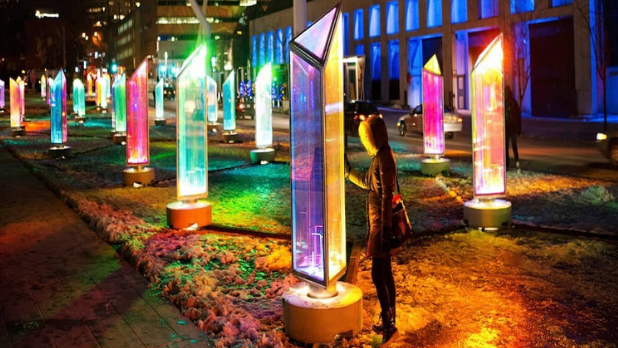 A person explores a structure at Ithaca's Winter Light Festival