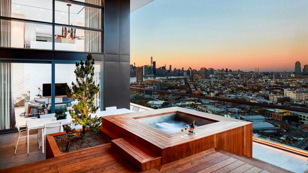 View of hot tub with Brooklyn and city behind in the distance