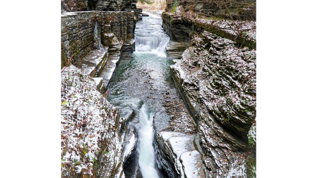 Water flowing down Robert Treman State Park Lower Falls on a winter day