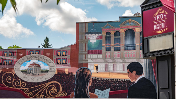 A mural of two people inside the Troy Savings Bank Music Hall