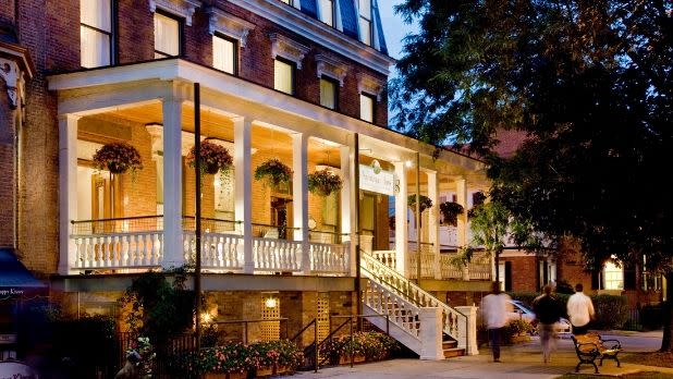 Exterior of Saratoga Arms Hotel at night in Saratoga Springs, New York