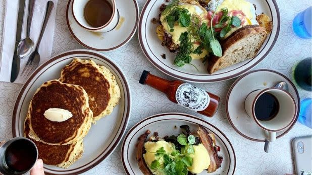An overhead photo of pancakes, and egg sandwiches with coffee at the West Taghkanic Diner
