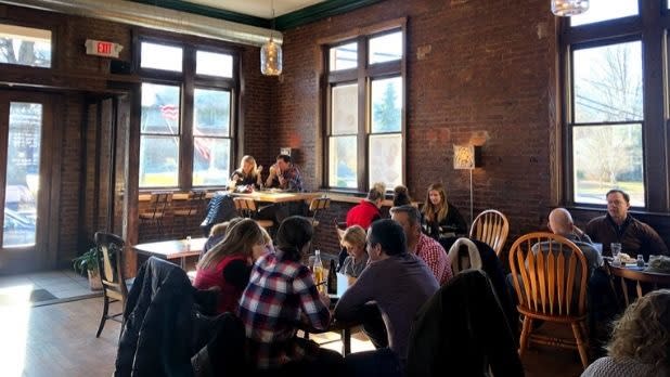 Patrons dine in the brick-walled interior of the Windham Local Public House