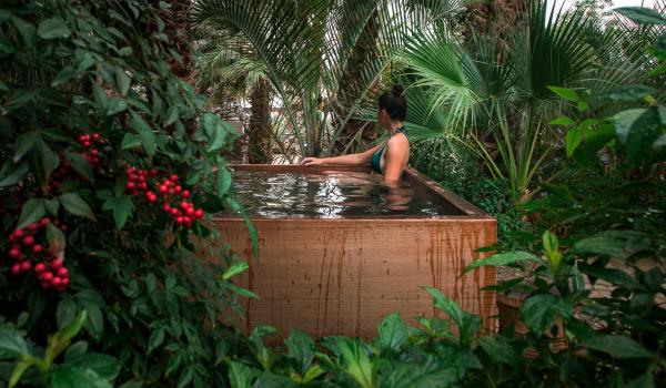 Woman relaxing in hot mineral pool at Two Bunch Palms resort in Desert Hot Springs