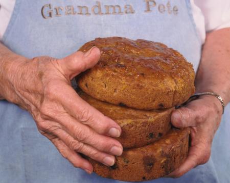 Grandma Pete holding her fruitcake