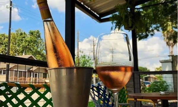 Wine bottle at Better Luck Tomorrow restaurant patio in Houston