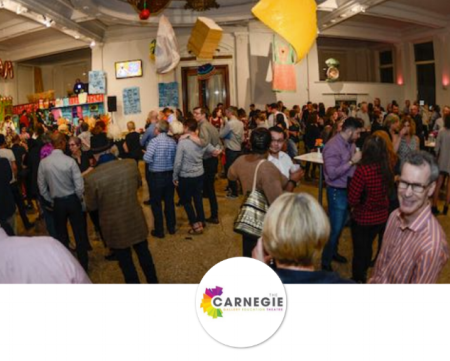 large crowd of people enjoying the art of food event at The Carnegie